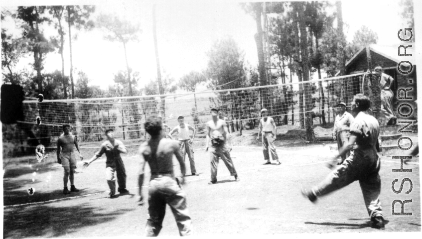 GIs play volleyball. in Yangkai, China, 1944. Art, Gross, Trombley, Kainne [Keiser?], Elmer Moore, Harry Leech, Lacher [or Lecher?], Alelunas, Doc Townsend  From the collection of Frank Bates.