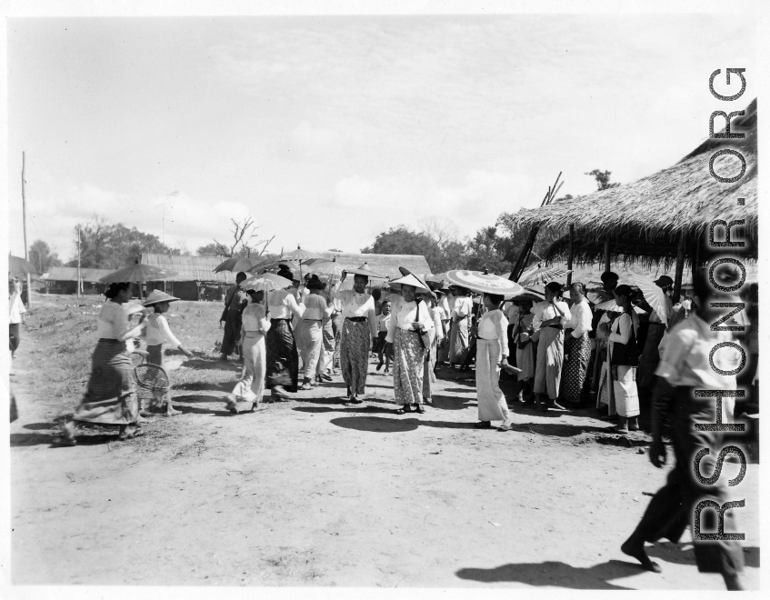 Ladies dressed in finery at an activity in Burma.  In Burma near the 797th Engineer Forestry Company.  During WWII.