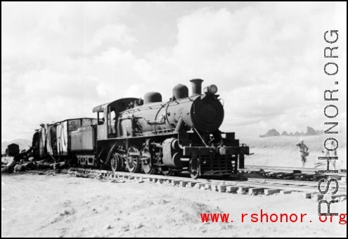 Allied gas train at the edge of the field, Liuzhou (Luichow), China Sept 1944, after a Japanese bombing raid, during WWII.