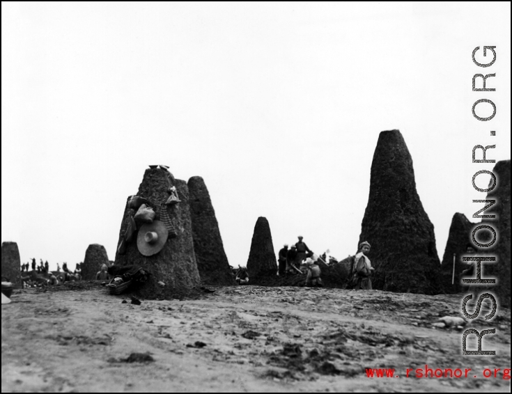 Excavation before construction at an American base in China during WWII.  The pillars are limestone, left after the soft soil had been dug away.  Likely to be in Guangxi, either Liuzhou or Guilin.   From the collection of Hal Geer.