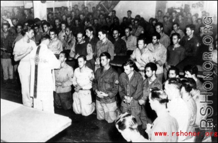 GIs have communion during church service on ship on the way back to the US after the war. The ship is probably the SS Marine Raven.