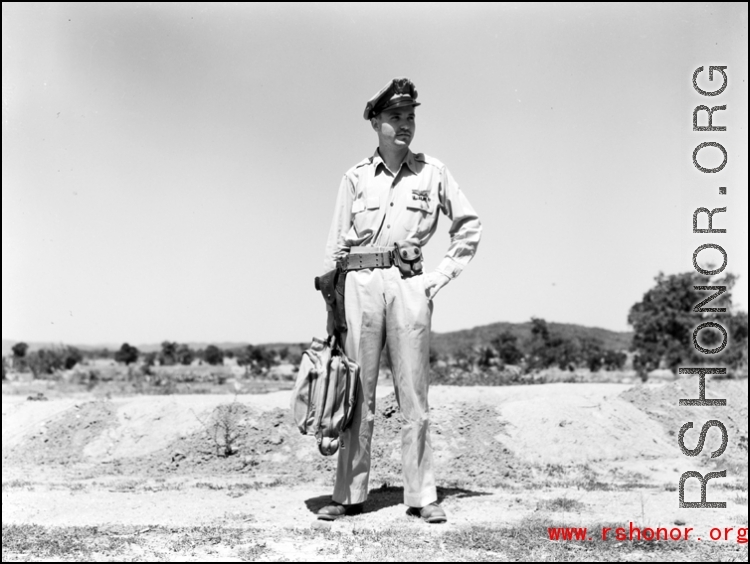 An American soldier with a handbag in the CBI.  From the collection of Wozniak, combat photographer for the 491st Bomb Squadron, in the CBI.