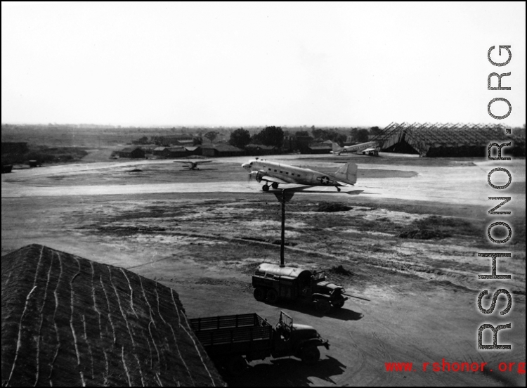 A C-47 transport plane with propellers turning, most likely in Assam, India.    From the collection of David Firman, 61st Air Service Group.