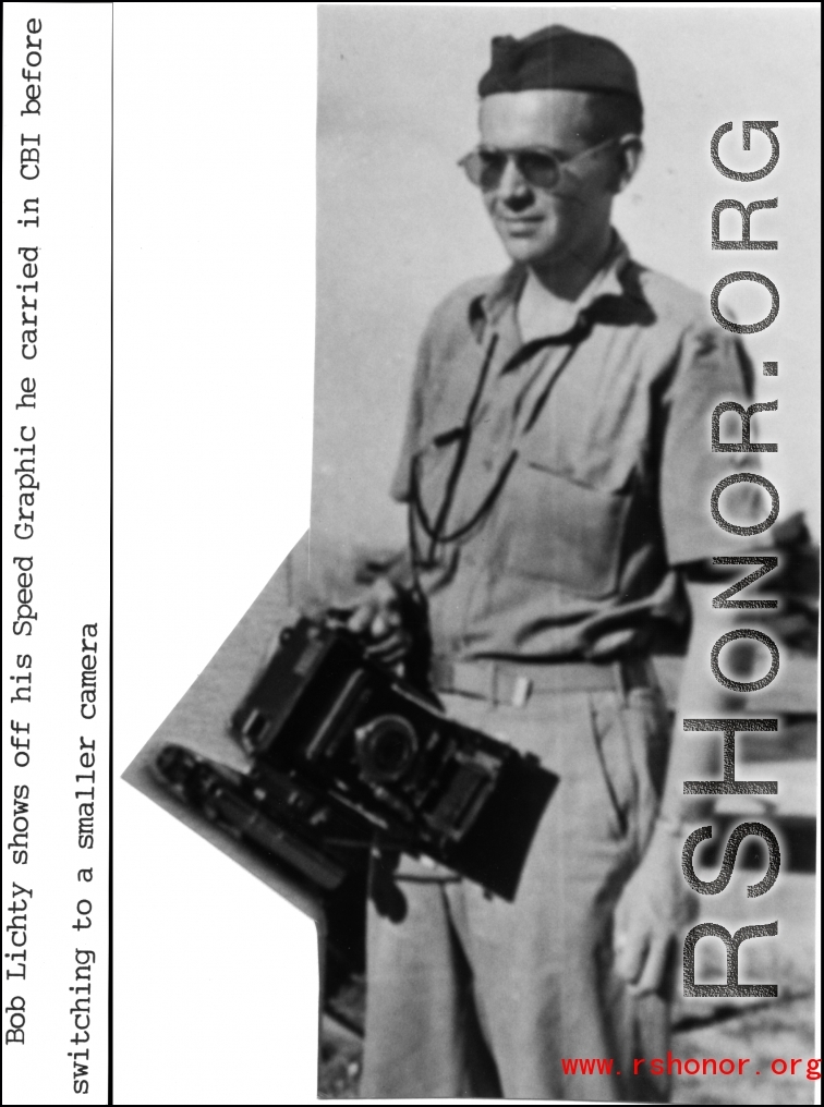 Bob Lichty shows off his Speed Graphic camera which he carried in the CBI before switching to a smaller camera.