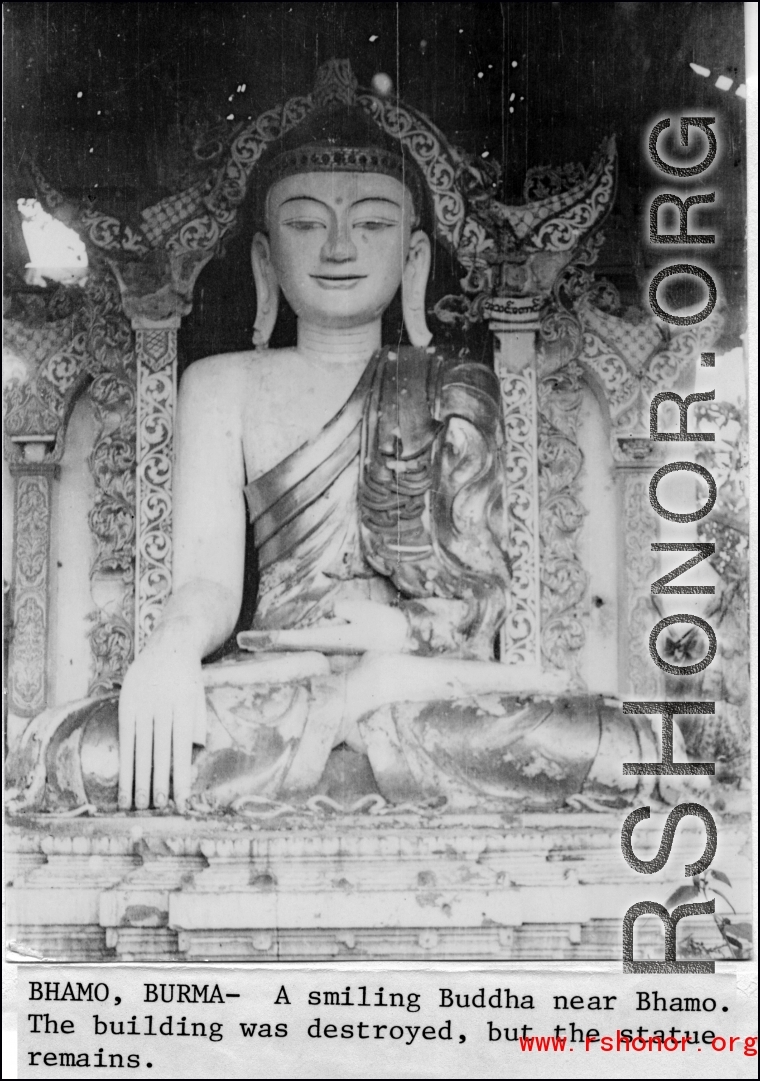 Smiling Buddha near Bhamo, Burma, during WWII.