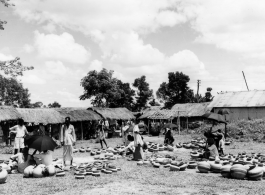 Earthenwares on display for sale at a market in Burma or India, during WWII.