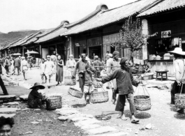 A bustling village street in SW China during WWII.