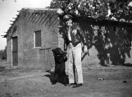 Flyer of Ringer Squadron with pet bear in the CBI during WWII.