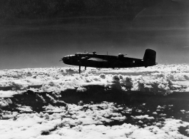 B-25s of the 22nd Bombardment Squadron in flight over SW China or Burma during WWII.