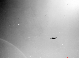 B-25 Mitchell bomber in flight in the CBI, in the area of southern China, Indochina, or Burma. During WWII.
