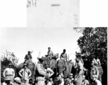 GIs pose with Kachin fighters (some riding elephants) in Burma during WWII.