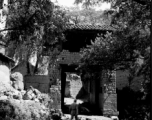 A village passageway through a village gate in Yunnan province, China. During WWII.
