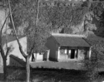 A small building among loess hills in northern China during WWII.