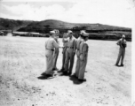 Major Gen. Charles B. Stone salutes during an award ceremony during a visit to Yangkai on the August 29, 1945. A photographer stands on the far right.  Yangkai, APO 212, during WWII.
