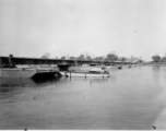 797th Engineer Forestry Company in Burma: Enormous floating bridge over a river on the Burma Road.  During WWII.