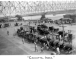 Rickshaw pullers and carriages await at Howrah Bridge in Calcutta, India, as seen by 2005th Ordnance Maintenance Company, 28th Air Depot Group, in India during WWII.