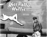 Flyer standing with F-7A "Rice Pattie Hattie." 24th Combat Mapping Squadron, 8th Photo Reconnaissance Group, 10th Air Force