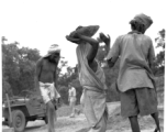 Laborers work at an American base in India, during WWII.