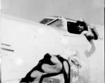 Pilot Mike Howes motions out cockpit window of F-7A/B-24. 24th Combat Mapping Squadron, 8th Photo Reconnaissance Group, 10th Air Force.