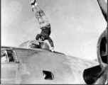 American flyer does a handstand on the two .05 cal guns of a turret on a F-7A/B-24.  24th Combat Mapping Squadron, 8th Photo Reconnaissance Group, 10th Air Force.