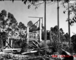 Bob Riese and friend explore remains of aircraft factory and hangers at the air base at Liuzhou, in 1945. The facilities at the base were first destroyed by the Chinese and Americans during retreat in the face of Ichigo during the fall of 1944, then may have been destroyed more by American bombardment during Japanese occupation, and possibly destroyed more by the Japanese as they retreated the area in 1945.