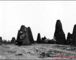 Excavation before construction at an American base in China during WWII.  The pillars are limestone, left after the soft soil had been dug away.  Likely to be in Guangxi, either Liuzhou or Guilin.   From the collection of Hal Geer.