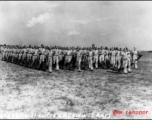 Members of the 61st Air Service Group marching in review on June 21, 1944, at LAAF (Laguna Army Airfield).