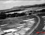 An aerial photograph taken from an American war plane over a Japanese-held railway in SW China or Indo-China during WWII in the CBI.
