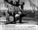 Chinese workers at an American base hang out the base laundry to dry in the sun, during WWII.  August 3, 1944