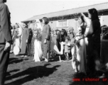 A group wedding in Yunnan province, China, during the hard war years of WWII.  Many of the grooms would have been soldiers and group weddings really came into style at around or just before the war years.