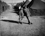 Scenes around Kunming city, Yunnan province, China, during WWII: GIs goof among tents at Kunming.