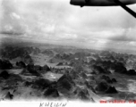 "Kweilin in aerial photo (land of a thousand breasts)."  Flying over distinct karst formations in Guangxi province, near Guilin (Kweilin), in China during WWII.