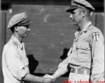 A handshake between unknown Chinese and American military personnel. In the CBI during WWII.