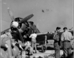 rew working out in the open on a non-American aircraft somewhere in southern China.  This is likely a Japanese Nakajima Ki-84 Hayate which the Chinese air force received after the war. 